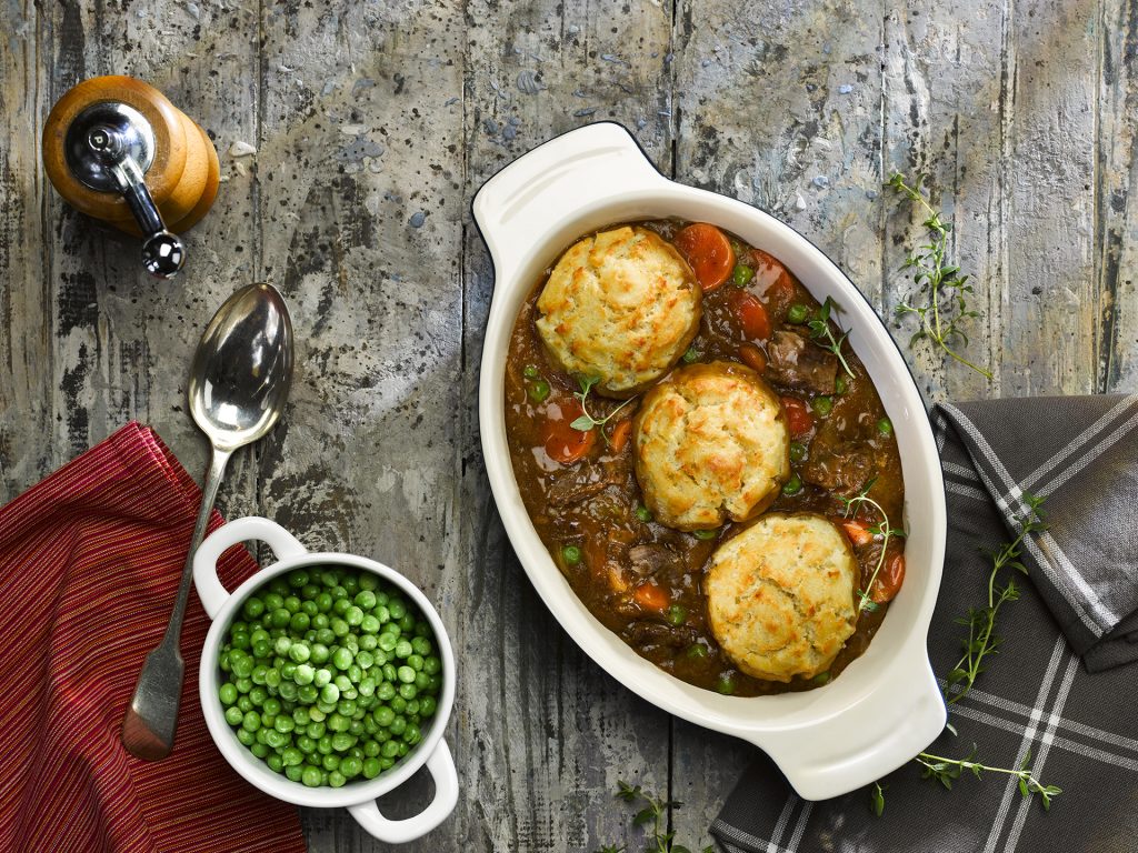 3 Cheese dumplings in a sauce on a tabletop